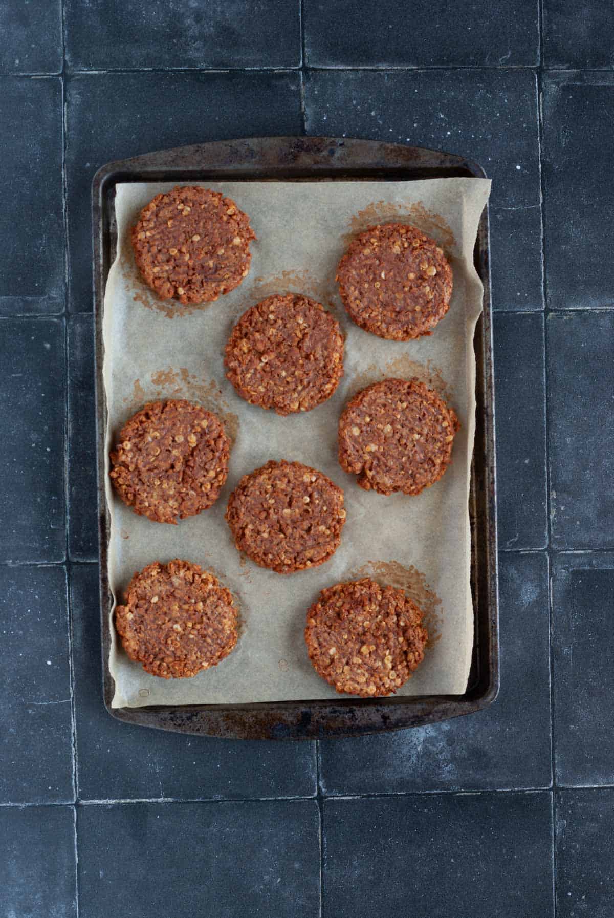 TVP and Lentil burger patties on a baking sheet.