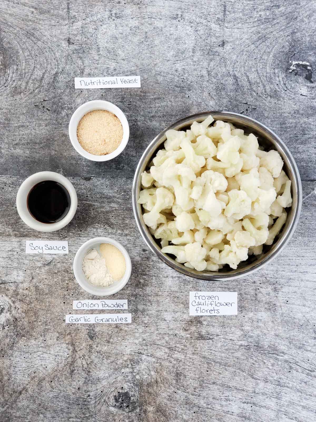 Ingredients for the roasted cauliflower including nutritional yeast, soy sauce, garlic powder and onion powder.