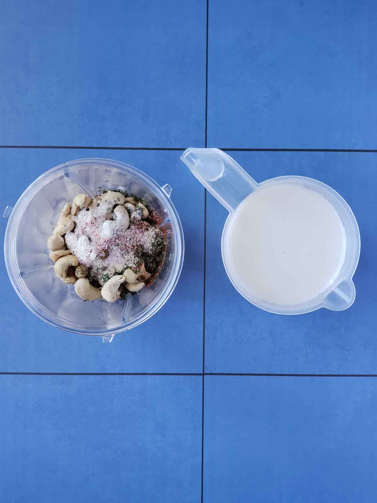 The dairy free ranch dressing ingredients in a blender ready to add the milk and vinegar.