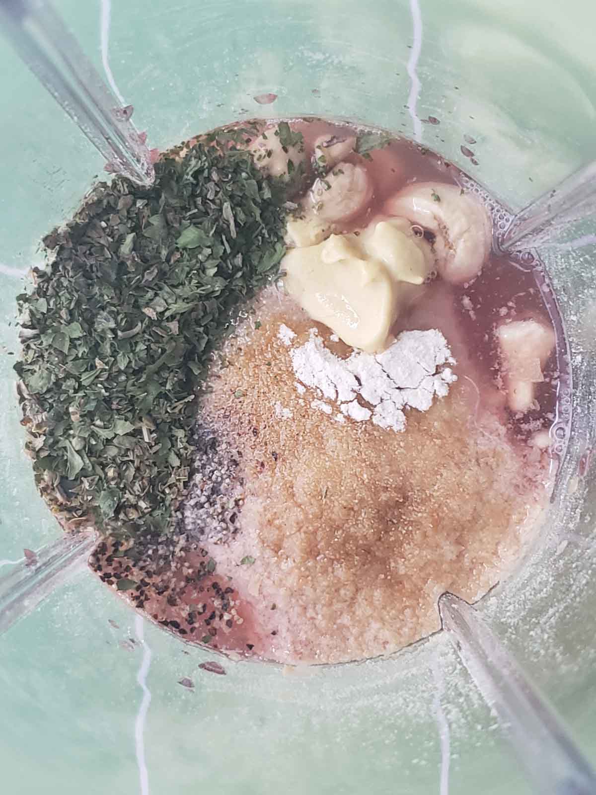 Ingredients in the blender cup for making the dressing.