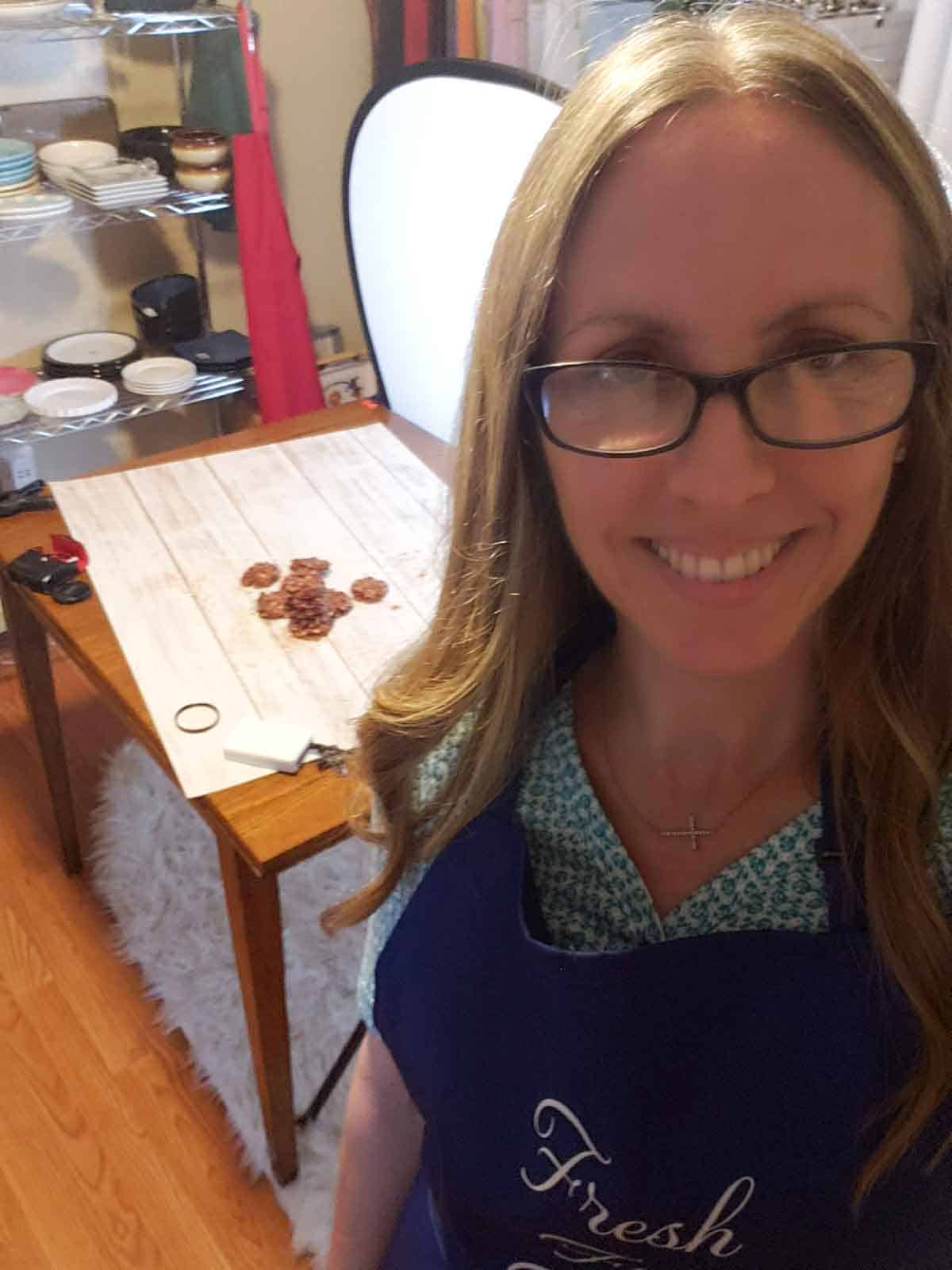 Rhonda standing in front of her cookie display ready to shoot the final images.