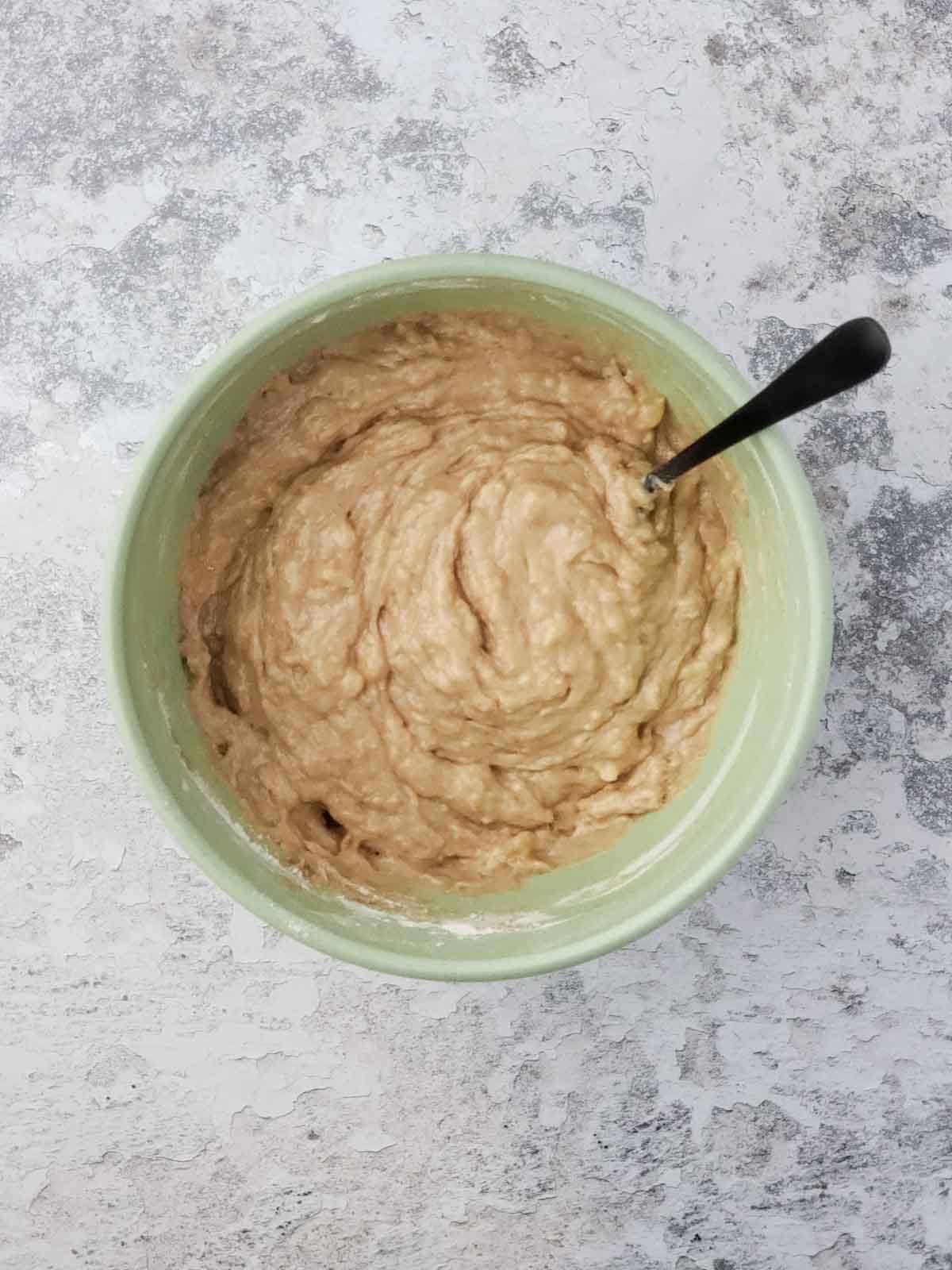 Thick banana bread batter after mixing wet and dry ingredients together.