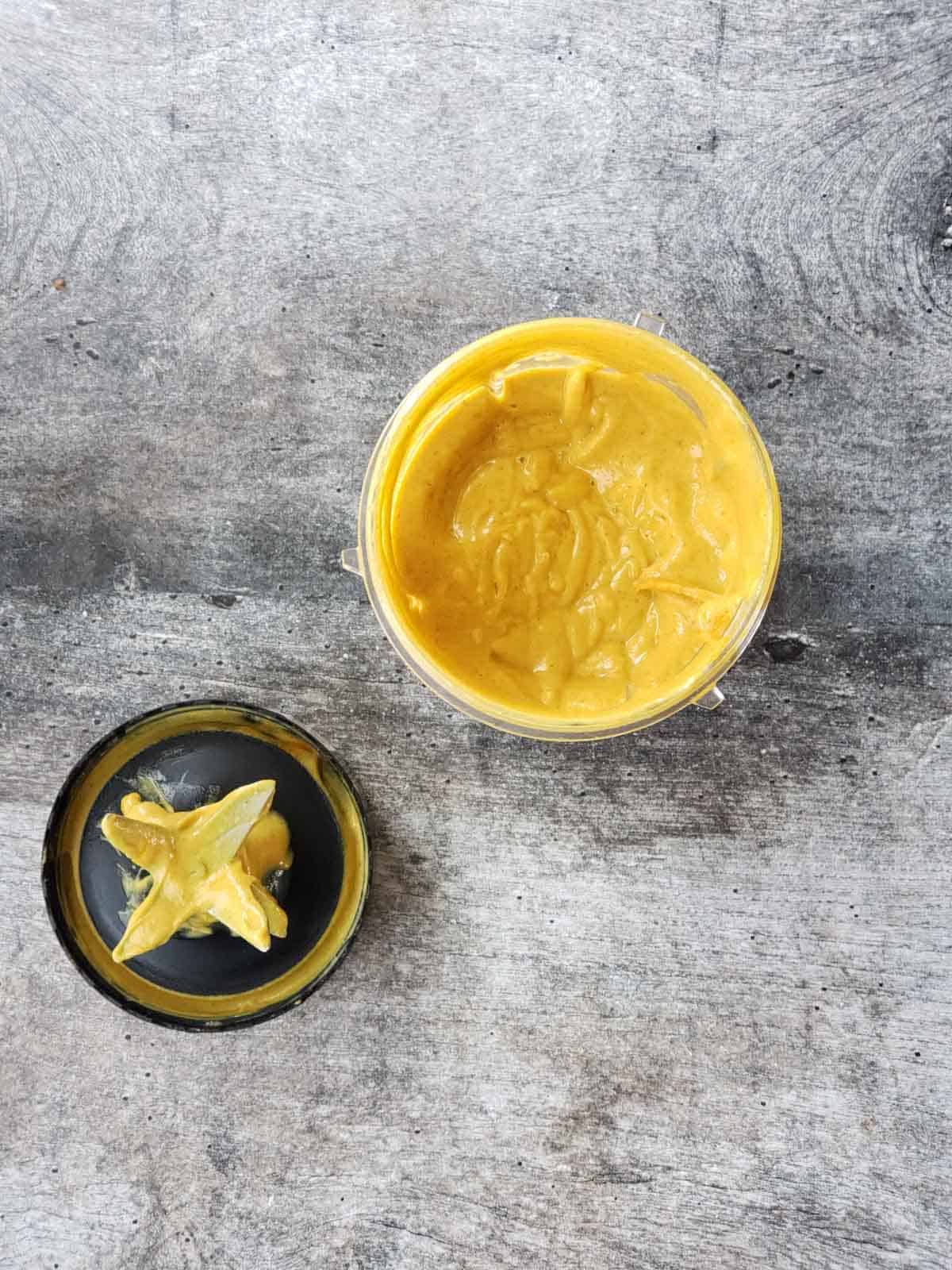 Thick creamy vegan pumpkin mixture just blended in a cup.