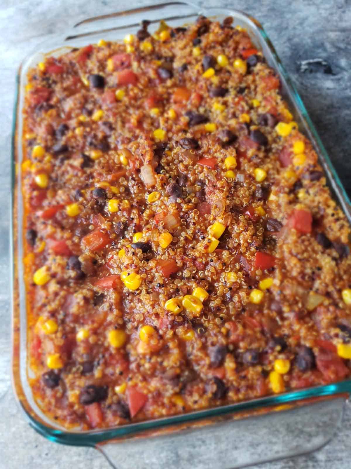 Close up of fully baked vegan enchilada casserole .