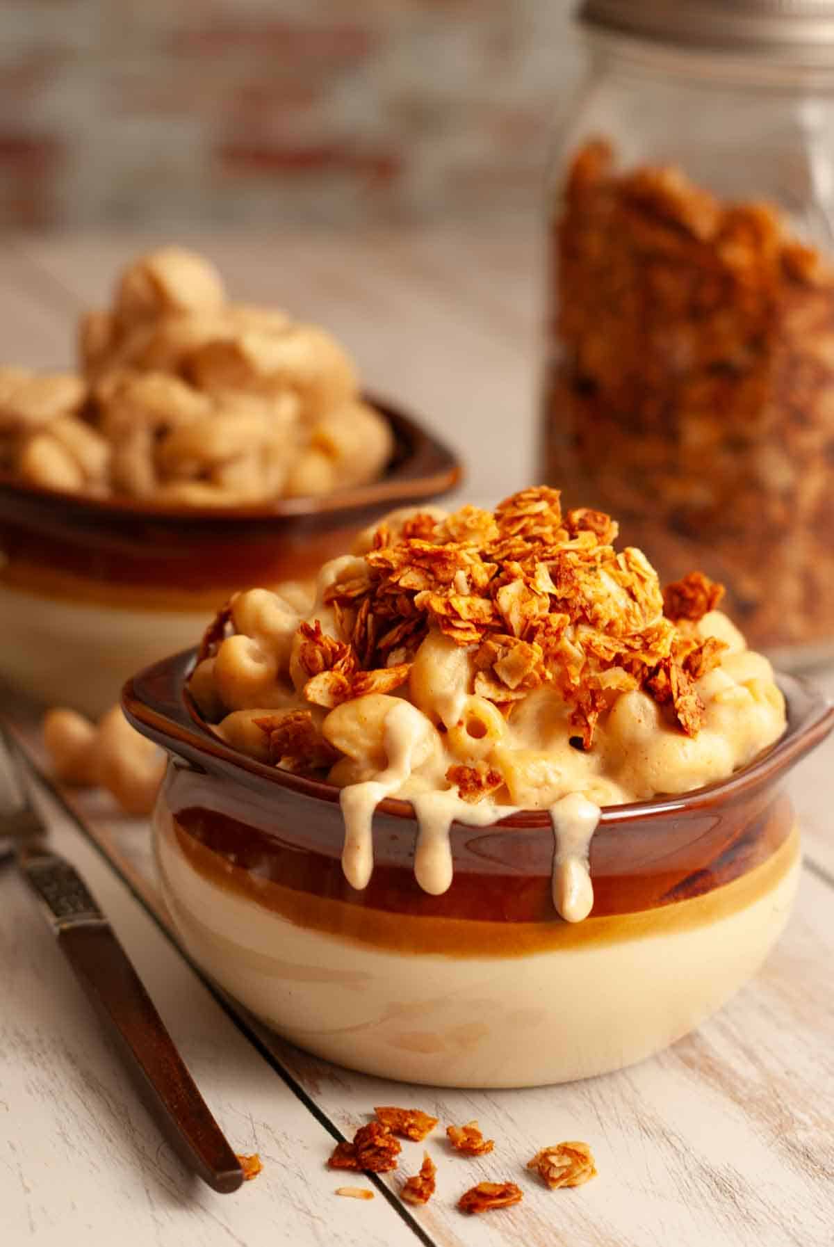 Crispy coconut bacon bits sprinkled over creamy vegan mac and cheese.