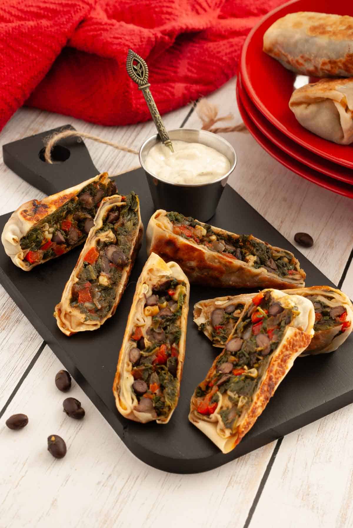 Crispy sliced southwest egg rolls filled with black beans, corn, spinach, and peppers served with creamy ranch for dipping.