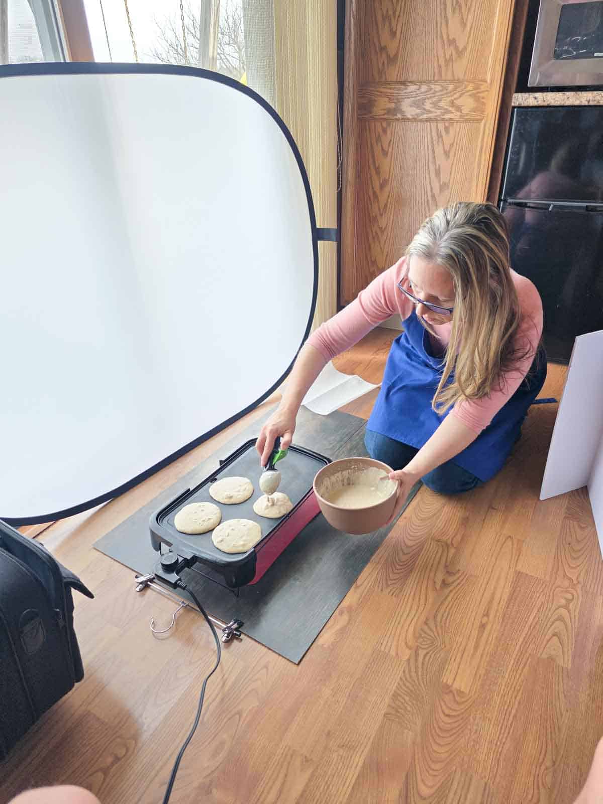 Behind the scenes photo of cooking pancakes with lighting setup.