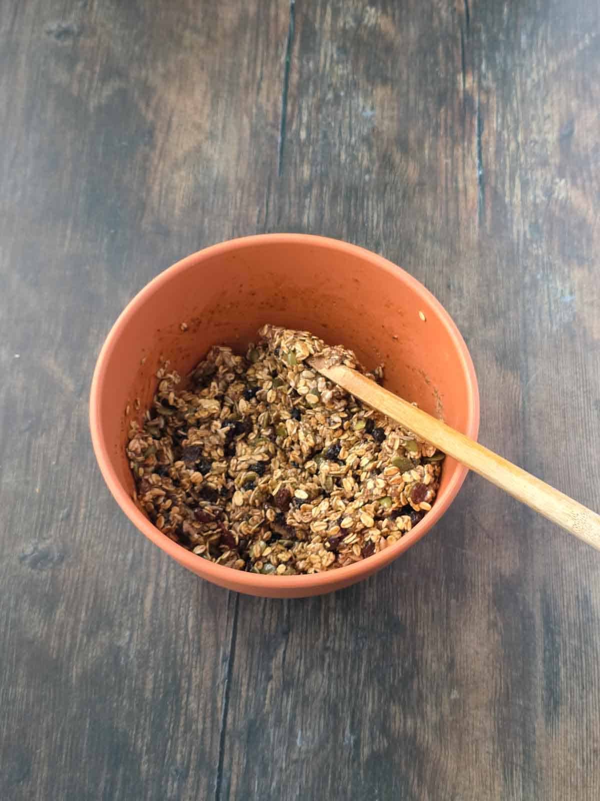 Chewy granola bar mixture fully combined and ready to press into the pan.